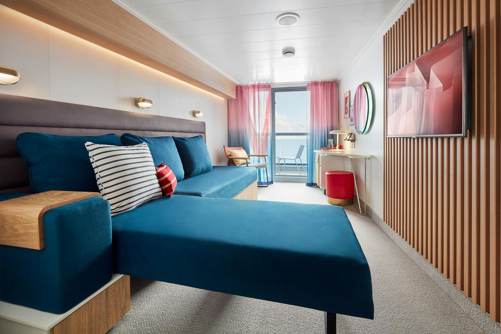 Central Sea Terrace cabin with a bed, sofa, and private balcony