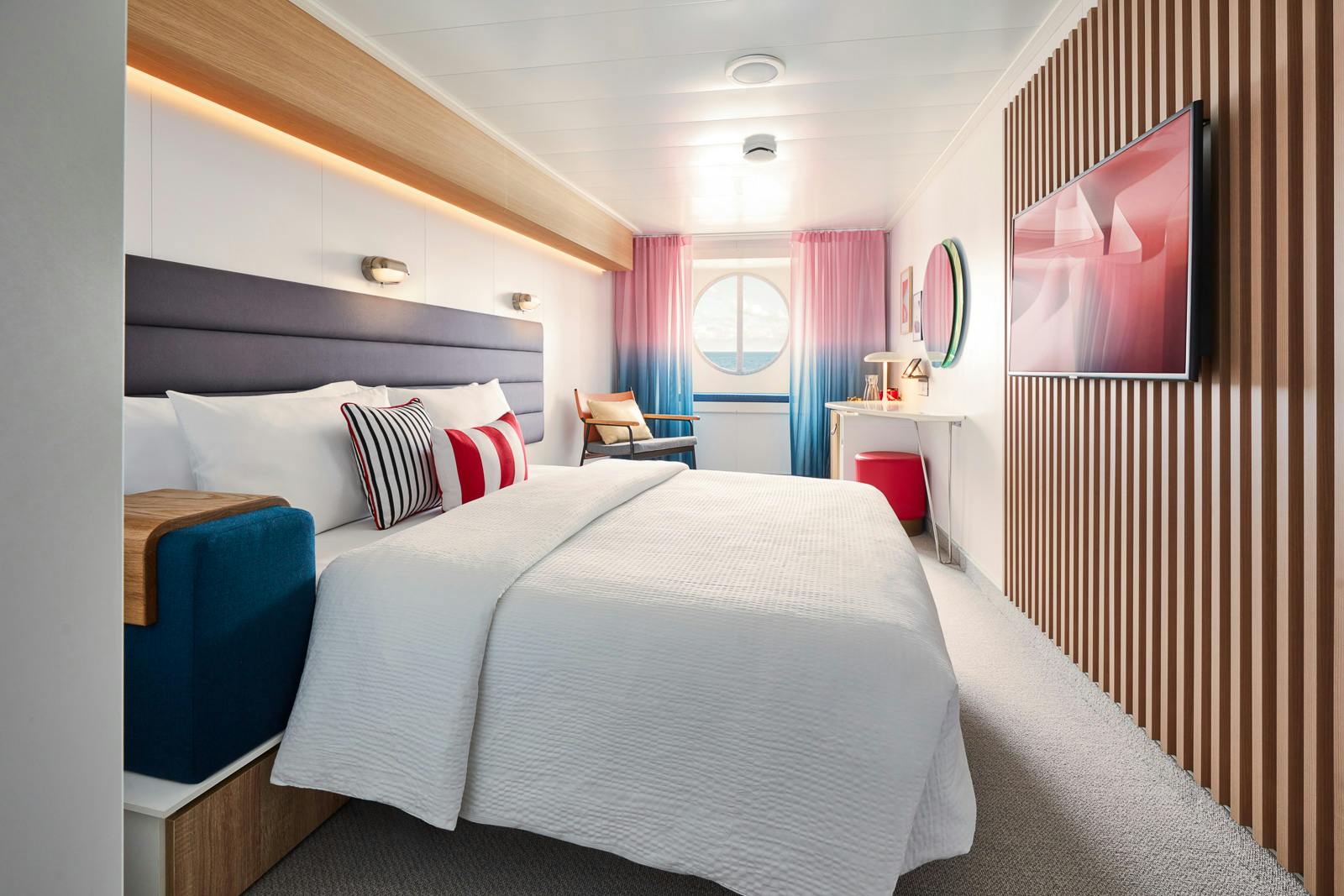 Sea View cabin with a bed beside a large ocean-facing window