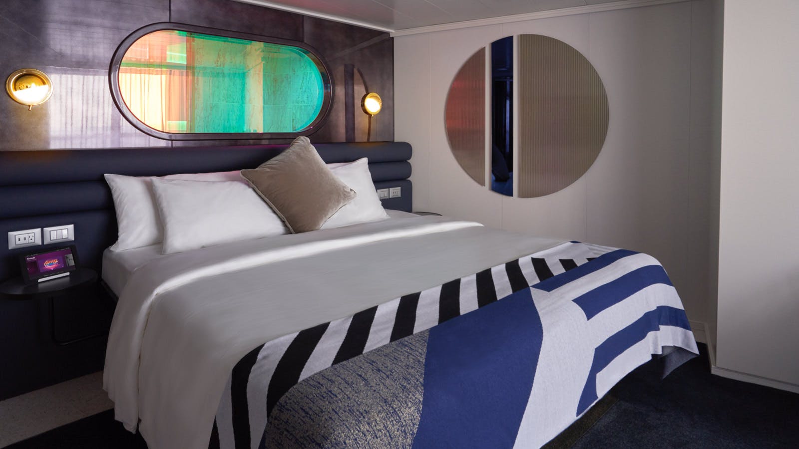 Seriously Suite bedroom with a king bed and statement lighting